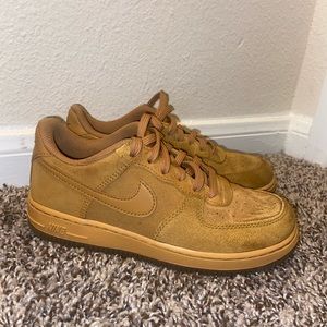 Little boy wheat colored Air Force 1s